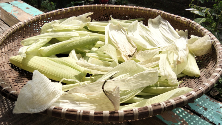 Drying corn husks in wicker basket