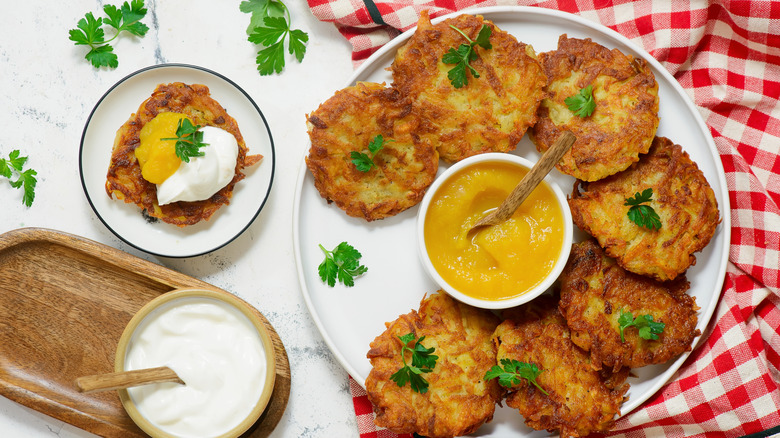 Plate of latkes with applesauce and sour cream