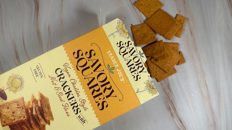 Trader Joe's Savory Squares and box on marbled surface