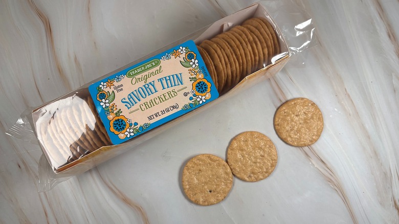 Trader Joe's Savory Thin Crackers and package on marbled surface