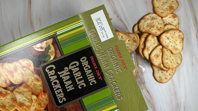 Trader Joe's Garlic Naan Crackers and box on marbled surface