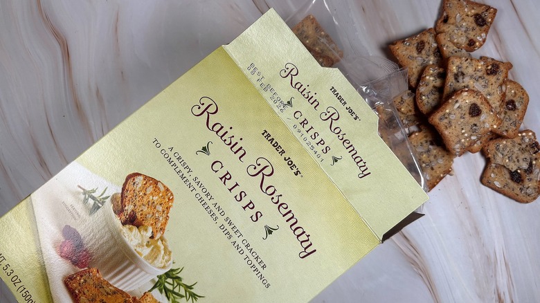 Trader Joe's Raisin Rosemary Crisps and box on marbled surface