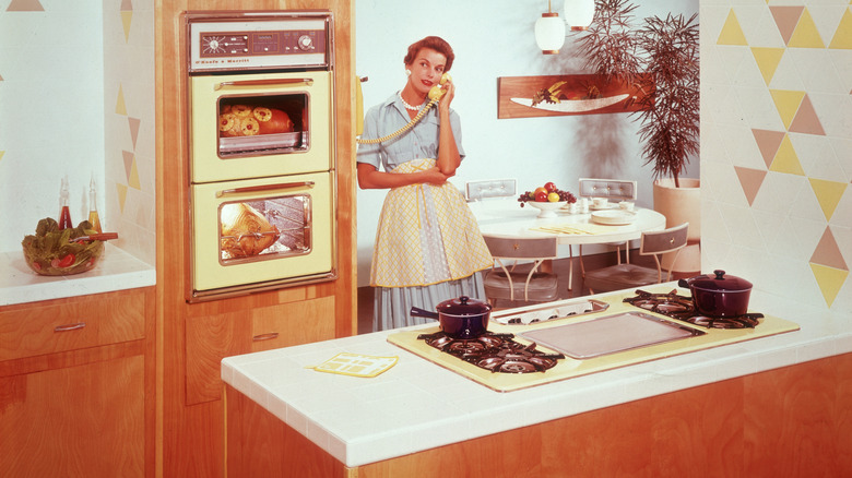 Woman on the phone in 1955 kitchen