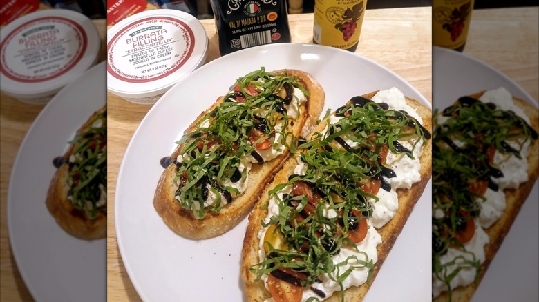 Two slices of toast on white plate with Trader Joe's Burrata Filling