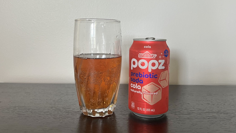 Summit Popz cola soda in a glass.