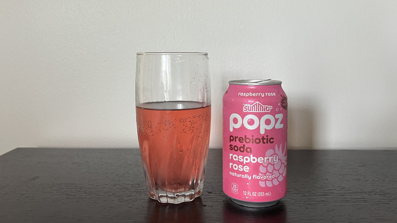Summit Popz raspberry rose soda in a glass.