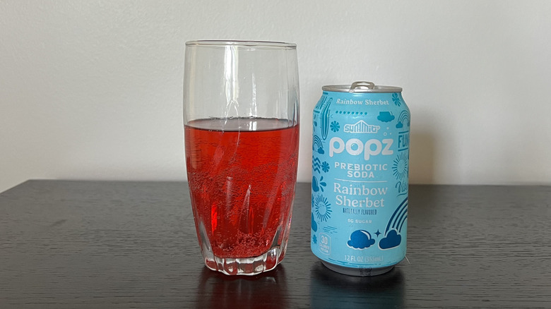 Summit Popz rainbow sherbet soda in a glass.