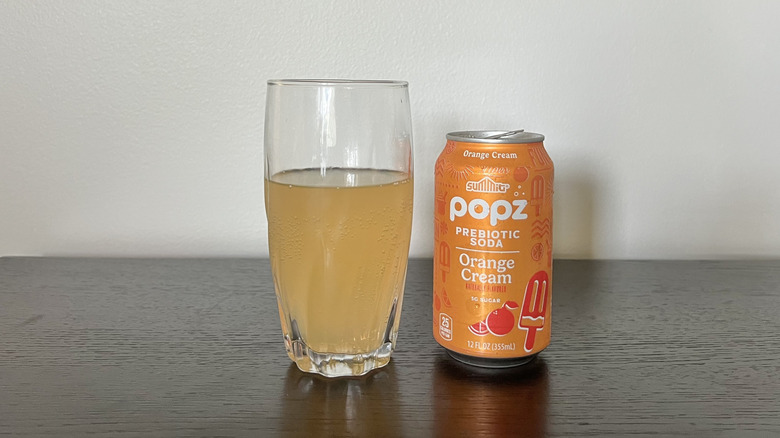 Summit Popz orange cream soda in a glass.