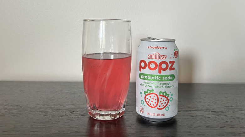 Summit Popz strawberry soda in a glass.