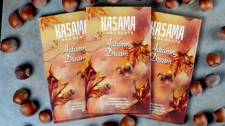 Overhead image of three Kasama chocolate bars surrounded by chestnuts