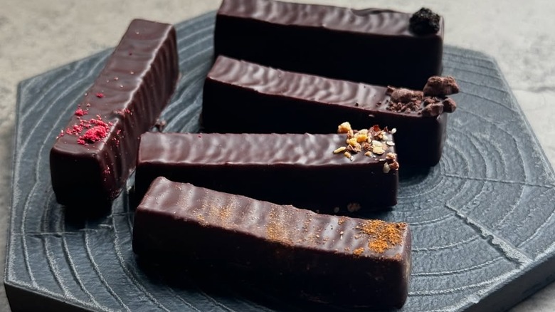 Selection of small chocolate bars on plates