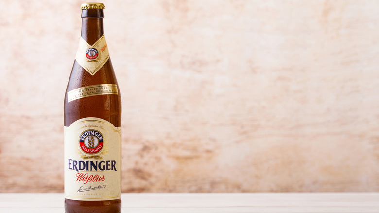 Bottle of Erdinger Weissbier on blurred light background