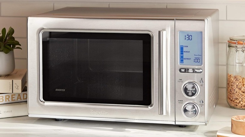 A Breville Smooth Wave microwave sitting on a kitchen counter