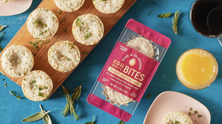 Trader Joe's Harvest Egg Bites on a plank beside the package