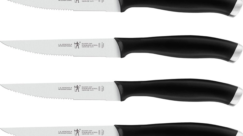 A product shot of four HENCKELS Silvercap knives on a plain white background
