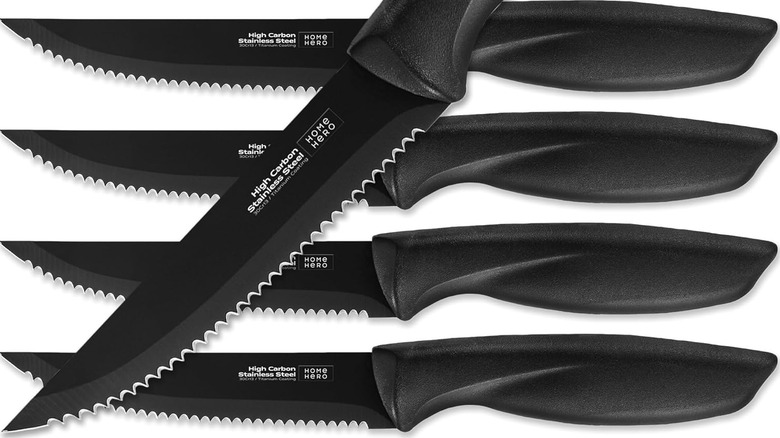 A product shot of Home Hero steak knives on a plain white background with one laid diagonally