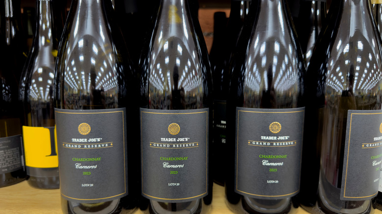 Several bottles of Trader Joe's chardonnay on shelf
