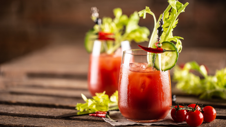 Bloody Mary cocktails with celery and peppers