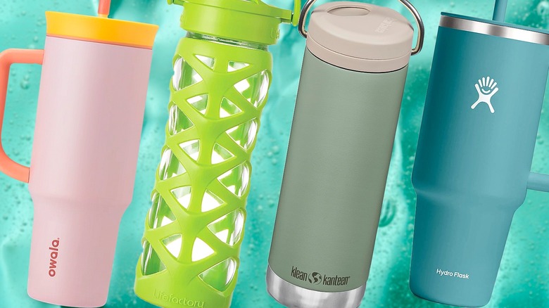 Colorful tumblers on background