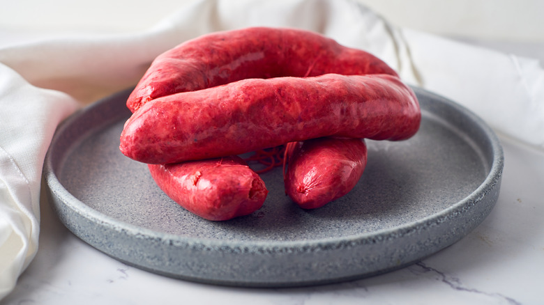 Mexican chorizo sausages stacked on plate