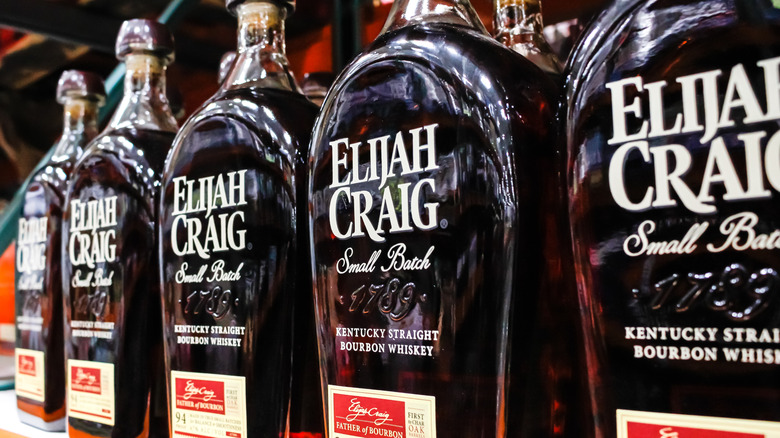 A close up shot of a row of Elijah Craig Small Batch on a liquor shelf