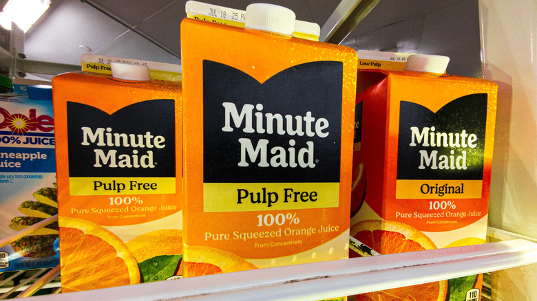 Cartons of Minute Maid pulp free 100% orange juice from concentrate in a store.