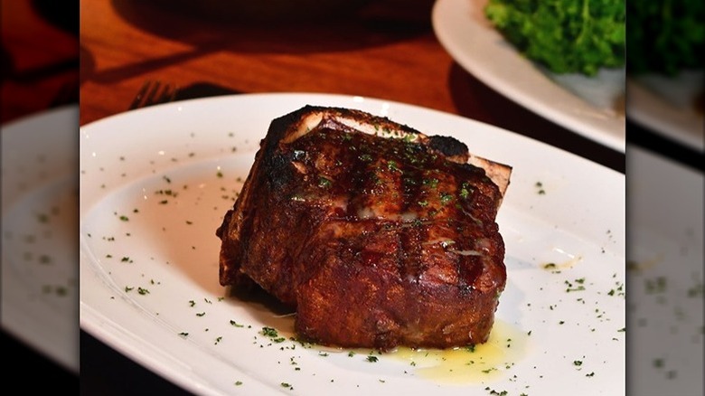 Mastro's Restaurants grilled bone-in filet on plate
