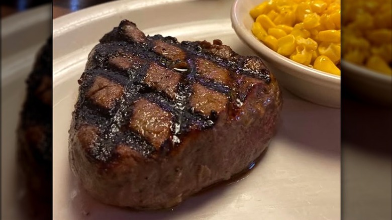Texas Roadhouse grilled filet mignon with corn on plate