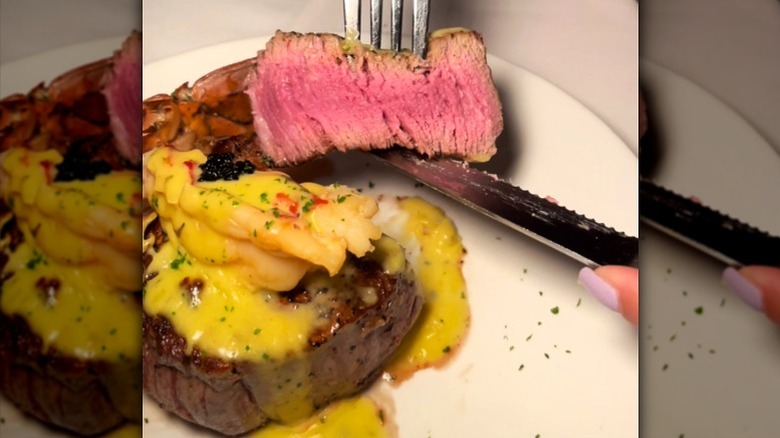 Fleming's Prime sliced filet mignon topped with seafood and sauce