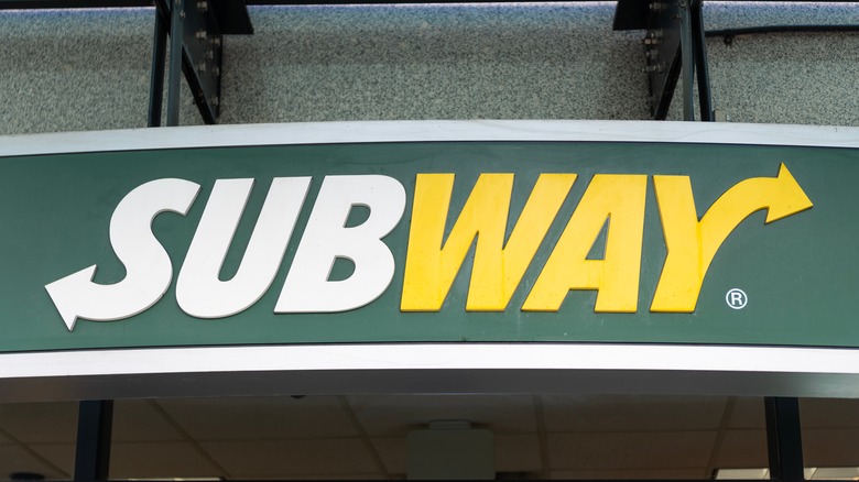 Green and yellow Subway sign on building