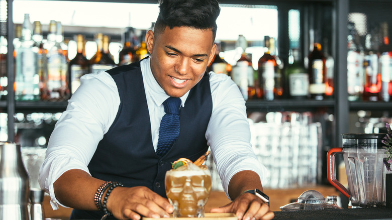 bartender presenting cocktail