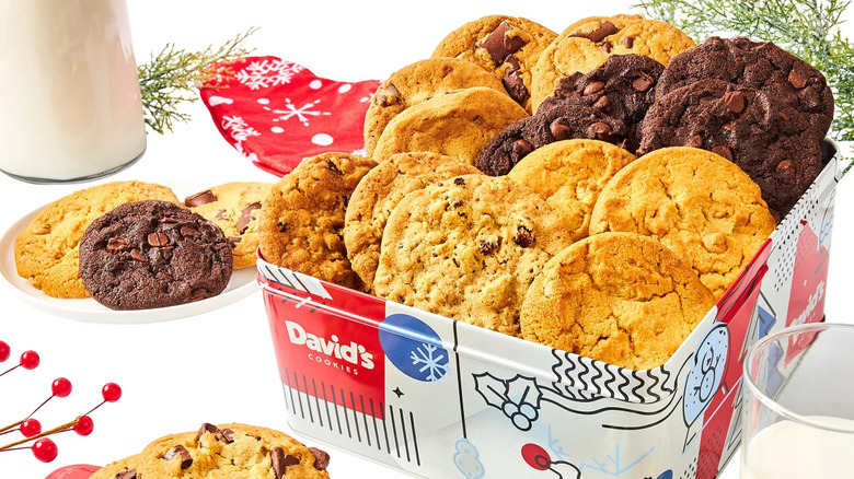 David's Cookies holiday cookie tin next to plate of cookies