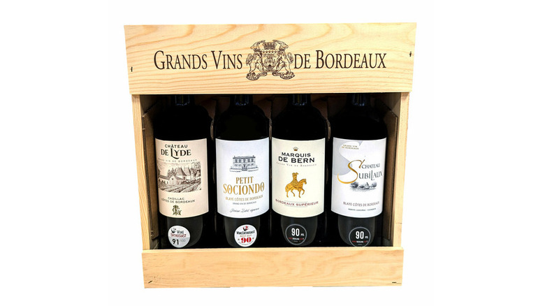 Four bottles of Grands Vins De Bordeaux wine in wooden box