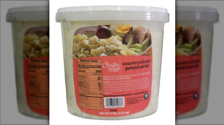 Country Maid classic country potato salad in a plastic container on a white background.