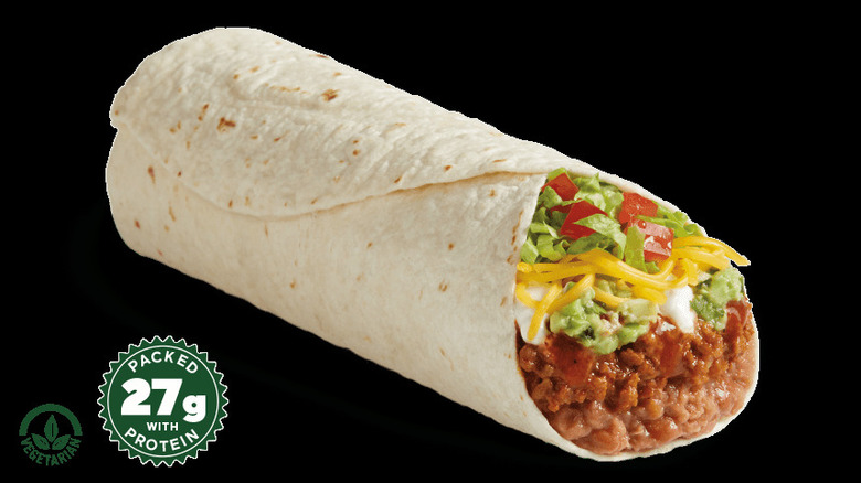 Beyond 8-layer burrito against a black background from Del Taco