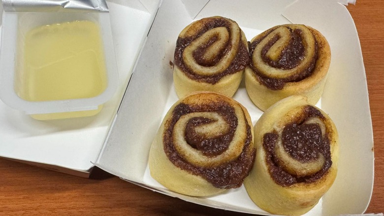 Four Cine Minis in paper box with clear dipping sauce