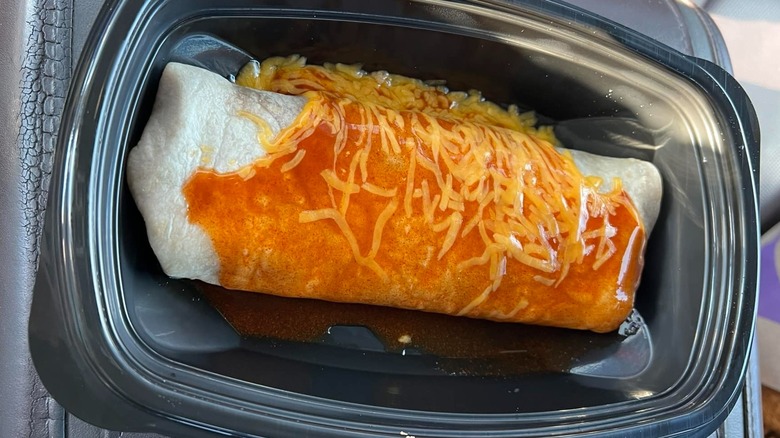 Enchirito in black plastic dish