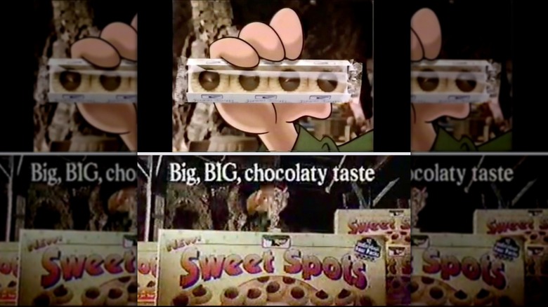 Still from a TV ad for Sweet Spots featuring a box and sleeve of cookies
