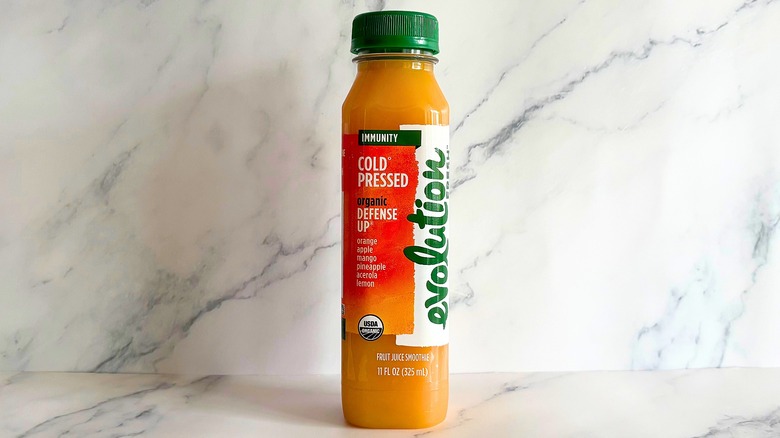 Evolution Fresh Defense Up juice on marble background