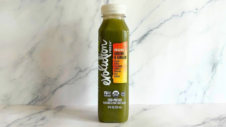 Evolution Fresh Greens & Ginger juice on marble background