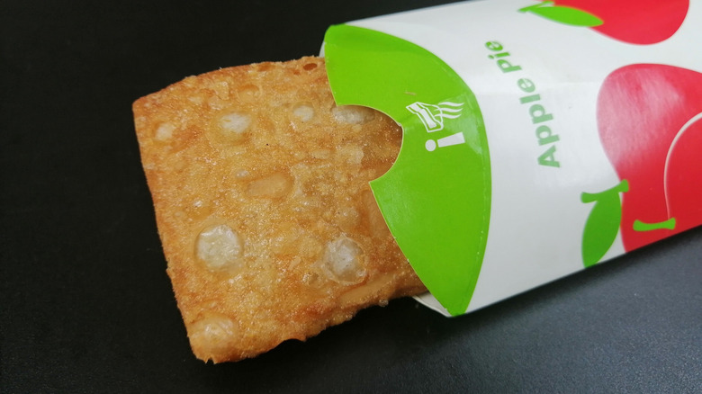 Fried apple pie from McDonald's on a black background