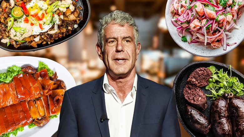 Anthony Bourdain surrounded by food