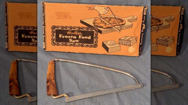 A frozen food saw sits under its box.