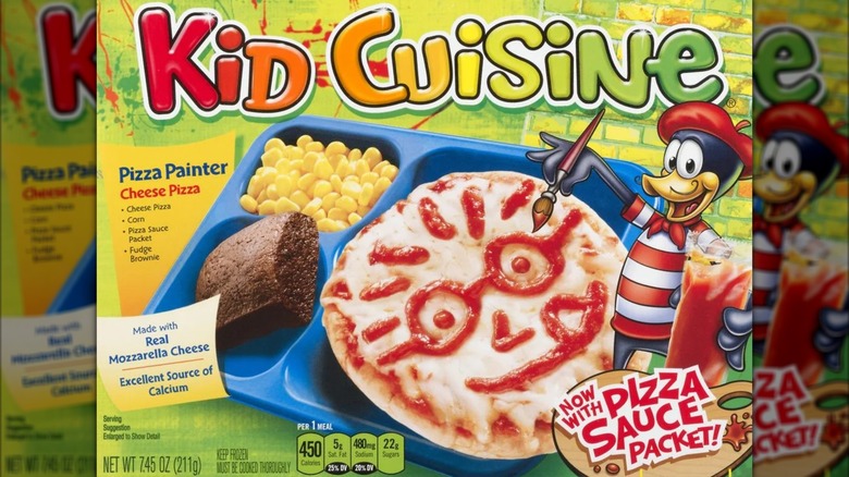 A box of Kid Cuisine Pizza Painter shows a cartoon duck painting a face on a frozen pizza.