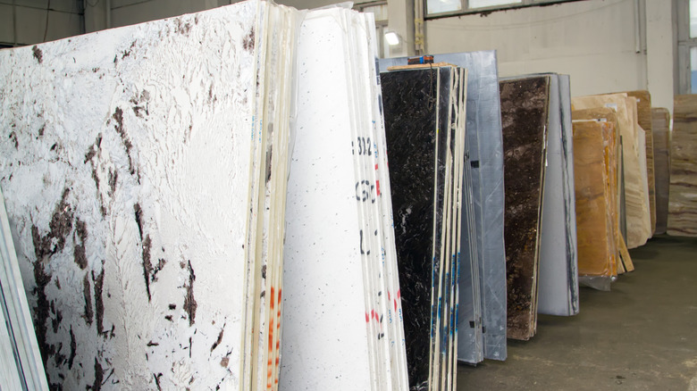 A line-up of several stone countertop slabs