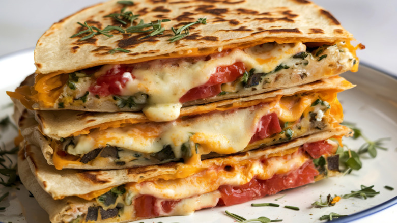 Stack of quesadillas stuffed with roasted veg and melted cheese