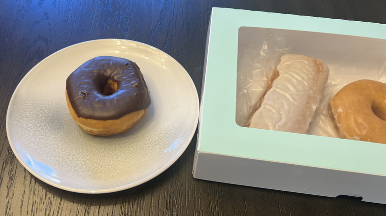 Chocolate iced donut from Kroger on a plate