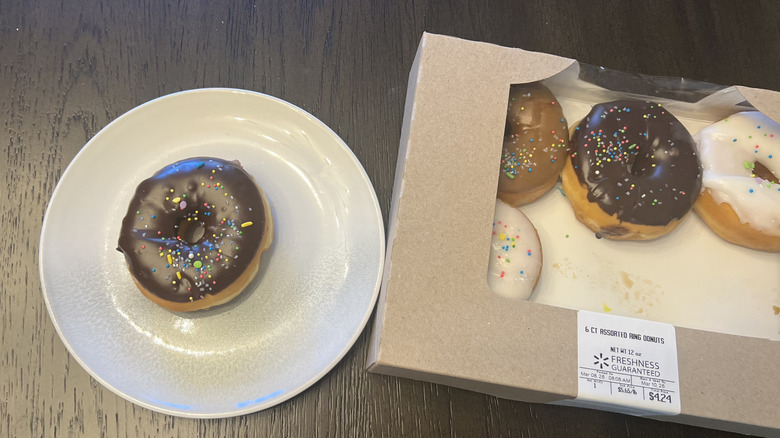 Chocolate iced donut with sprinkles from Walmart on a plate