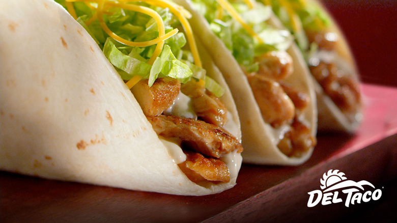 three Del Taco grilled chicken street tacos