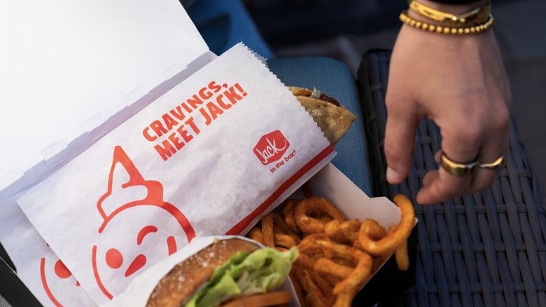 Jack in the Box jack wrap, burger and fries in a to-go container